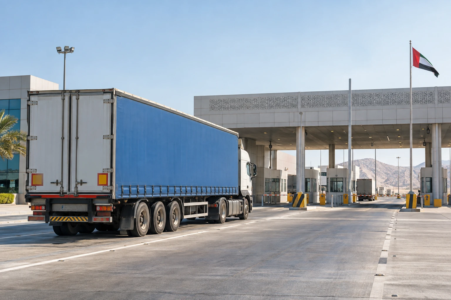 A curtain-side trailer at a UAE border crossing